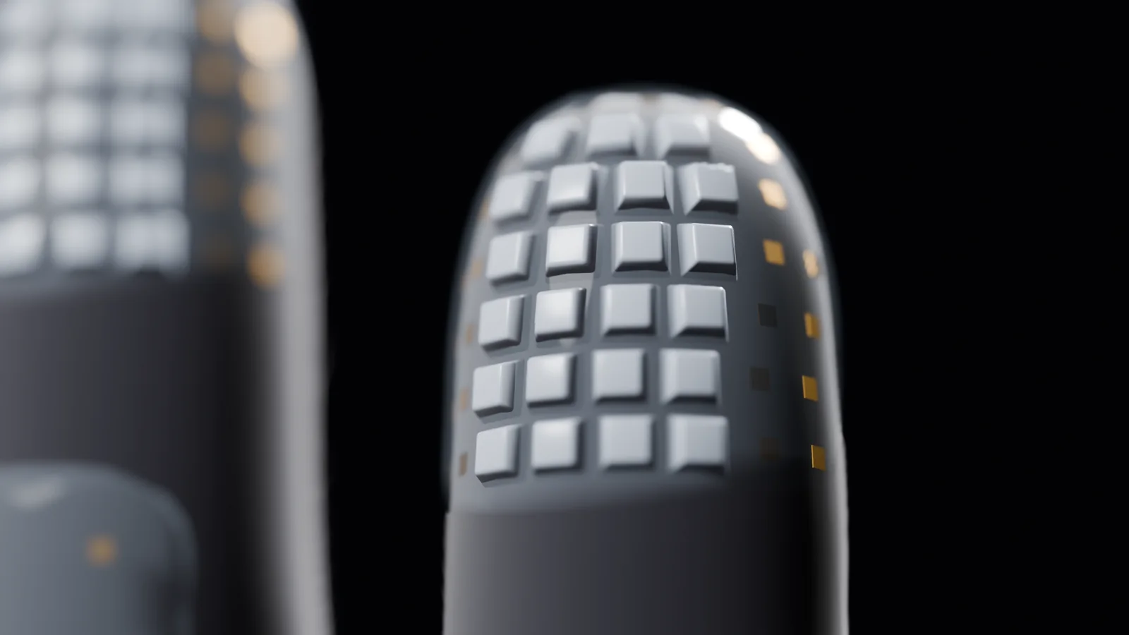 Close view of the index fingertip of the glove: 23 silicone keycaps in rows over the pad.