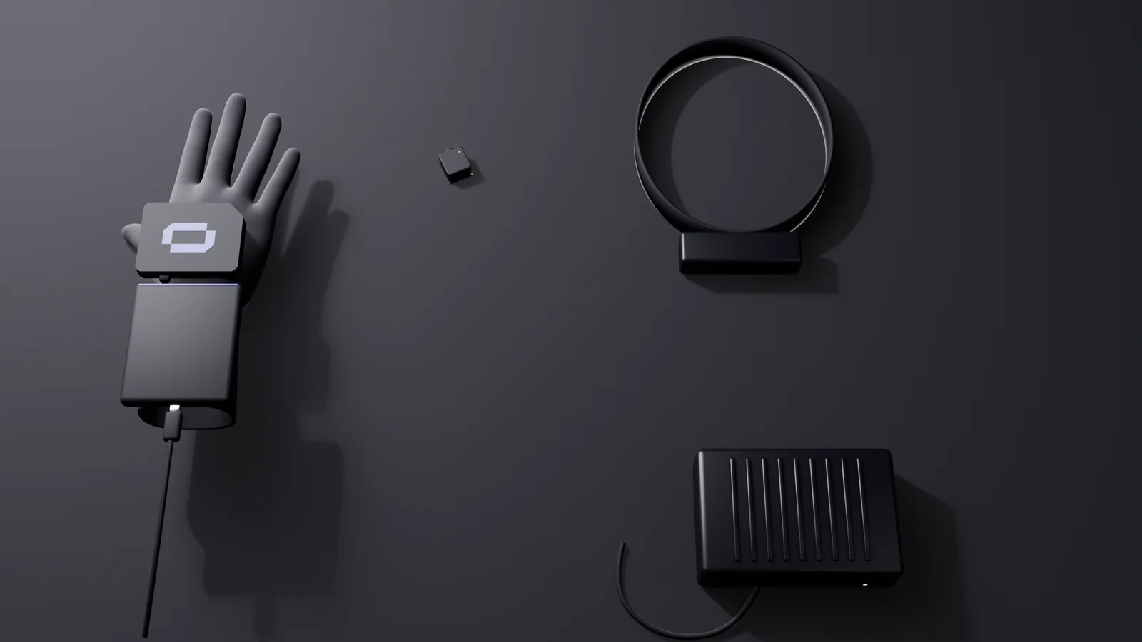 The capture kit laid out from above: the glove with its cuff module, the slide-on wrist camera, the head stereo camera on its band, the edge computer and its cable.